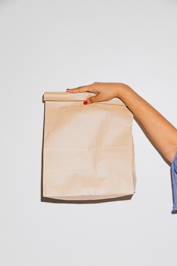 Woman Holding Paper Bag Takeaway